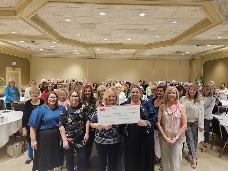 100 Women Who Care Windsor-Essex presents Sharon Colman with their donation
